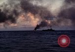 Image of ships burn Saipan Northern Mariana Islands, 1944, second 26 stock footage video 65675035299