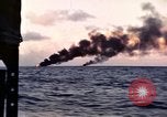 Image of ships burn Saipan Northern Mariana Islands, 1944, second 27 stock footage video 65675035299