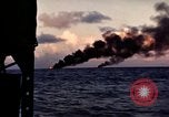 Image of ships burn Saipan Northern Mariana Islands, 1944, second 28 stock footage video 65675035299
