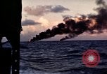 Image of ships burn Saipan Northern Mariana Islands, 1944, second 30 stock footage video 65675035299