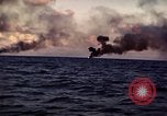 Image of ships burn Saipan Northern Mariana Islands, 1944, second 32 stock footage video 65675035299