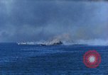 Standbild Bombardierung auf Schiffen Saipan Nördliche Marianen, 1944, aus Sekunde 10 historischem Filmmaterial Videoclip 65675035320