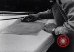 Image of navigator plotting a course Pacific Ocean, 1942, second 14 stock footage video 65675035344