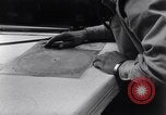 Image of navigator plotting a course Pacific Ocean, 1942, second 15 stock footage video 65675035344