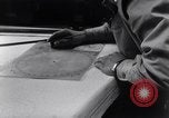 Image of navigator plotting a course Pacific Ocean, 1942, second 16 stock footage video 65675035344