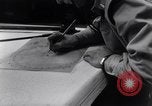 Image of navigator plotting a course Pacific Ocean, 1942, second 17 stock footage video 65675035344