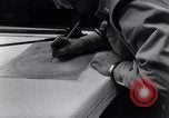 Image of navigator plotting a course Pacific Ocean, 1942, second 18 stock footage video 65675035344