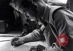 Image of navigator plotting a course Pacific Ocean, 1942, second 19 stock footage video 65675035344
