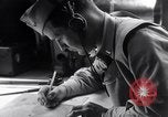 Image of navigator plotting a course Pacific Ocean, 1942, second 23 stock footage video 65675035344