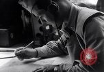 Image of navigator plotting a course Pacific Ocean, 1942, second 31 stock footage video 65675035344
