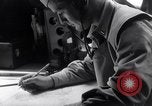 Image of navigator plotting a course Pacific Ocean, 1942, second 32 stock footage video 65675035344