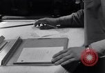 Image of navigator plotting a course Pacific Ocean, 1942, second 57 stock footage video 65675035344