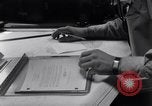 Image of navigator plotting a course Pacific Ocean, 1942, second 58 stock footage video 65675035344