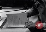 Image of navigator plotting a course Pacific Ocean, 1942, second 62 stock footage video 65675035344