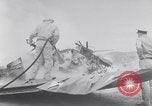 Image of Navy firefighters working at crash sites Pacific Theater, 1942, second 3 stock footage video 65675035347