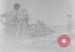 Image of Navy firefighters working at crash sites Pacific Theater, 1942, second 5 stock footage video 65675035347