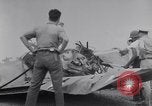Image of Navy firefighters working at crash sites Pacific Theater, 1942, second 8 stock footage video 65675035347