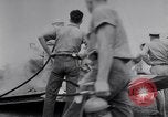 Image of Navy firefighters working at crash sites Pacific Theater, 1942, second 10 stock footage video 65675035347