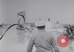 Image of Navy firefighters working at crash sites Pacific Theater, 1942, second 30 stock footage video 65675035347