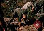 Image of US troops digging foxholes during Operation Big Spring  Vietnam, 1967, second 9 stock footage video 65675035381