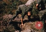Image of US troops digging foxholes during Operation Big Spring  Vietnam, 1967, second 14 stock footage video 65675035381
