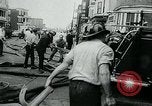 Image of Twenty-three tenement houses consumed by fire in Dorchester area of Boston Boston Massachusetts USA, 1964, second 38 stock footage video 65675035421