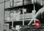 Image of Twenty-three tenement houses consumed by fire in Dorchester area of Boston Boston Massachusetts USA, 1964, second 50 stock footage video 65675035421