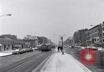 Image of Lenox Avenue, Harlem, New York City, on a snowy day New York City USA, 1963, second 3 stock footage video 65675035550