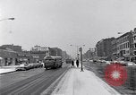 Image of Lenox Avenue, Harlem, New York City, on a snowy day New York City USA, 1963, second 4 stock footage video 65675035550