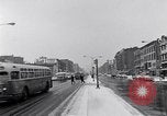 Image of Lenox Avenue, Harlem, New York City, on a snowy day New York City USA, 1963, second 6 stock footage video 65675035550