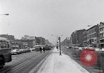 Image of Lenox Avenue, Harlem, New York City, on a snowy day New York City USA, 1963, second 7 stock footage video 65675035550