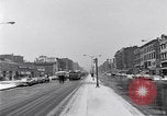 Image of Lenox Avenue, Harlem, New York City, on a snowy day New York City USA, 1963, second 8 stock footage video 65675035550