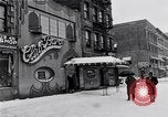 Image of Lenox Avenue, Harlem, New York City, on a snowy day New York City USA, 1963, second 10 stock footage video 65675035550