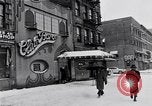 Image of Lenox Avenue, Harlem, New York City, on a snowy day New York City USA, 1963, second 12 stock footage video 65675035550
