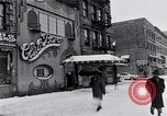 Image of Lenox Avenue, Harlem, New York City, on a snowy day New York City USA, 1963, second 13 stock footage video 65675035550