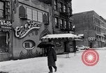Image of Lenox Avenue, Harlem, New York City, on a snowy day New York City USA, 1963, second 14 stock footage video 65675035550