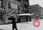 Image of Lenox Avenue, Harlem, New York City, on a snowy day New York City USA, 1963, second 15 stock footage video 65675035550