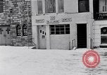 Image of Lenox Avenue, Harlem, New York City, on a snowy day New York City USA, 1963, second 23 stock footage video 65675035550