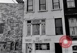 Image of Lenox Avenue, Harlem, New York City, on a snowy day New York City USA, 1963, second 26 stock footage video 65675035550