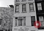 Image of Lenox Avenue, Harlem, New York City, on a snowy day New York City USA, 1963, second 27 stock footage video 65675035550