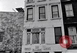 Image of Lenox Avenue, Harlem, New York City, on a snowy day New York City USA, 1963, second 28 stock footage video 65675035550