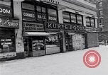 Image of Lenox Avenue, Harlem, New York City, on a snowy day New York City USA, 1963, second 42 stock footage video 65675035550