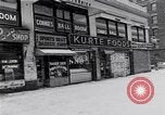 Image of Lenox Avenue, Harlem, New York City, on a snowy day New York City USA, 1963, second 43 stock footage video 65675035550