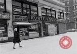 Image of Lenox Avenue, Harlem, New York City, on a snowy day New York City USA, 1963, second 45 stock footage video 65675035550