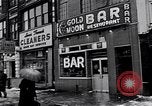 Image of Lenox Avenue, Harlem, New York City, on a snowy day New York City USA, 1963, second 55 stock footage video 65675035550