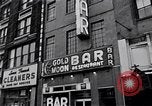 Image of Lenox Avenue, Harlem, New York City, on a snowy day New York City USA, 1963, second 57 stock footage video 65675035550