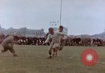 Image of Football field in racecourse infield Tsingtao China, 1946, second 30 stock footage video 65675035638