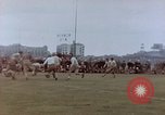Image of Football field in racecourse infield Tsingtao China, 1946, second 44 stock footage video 65675035638