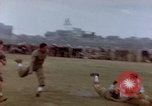Image of Football field in racecourse infield Tsingtao China, 1946, second 51 stock footage video 65675035638