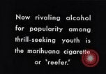 Image of marijuana cigarette New York City USA, 1939, second 3 stock footage video 65675035678